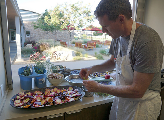 A man putting together food