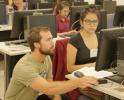 students working together on a computer